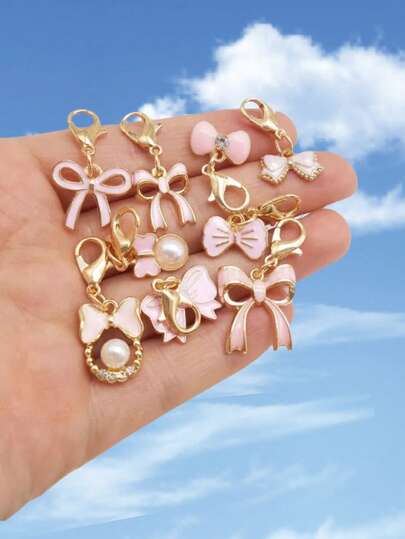 9个粉色可爱蝴蝶结吊坠，时尚魅力蝴蝶结吊坠，带龙虾扣，珐琅蝴蝶结吊坠，适用于珠宝制作，可DIY手链吊坠、包包挂饰、鞋子装饰、服装配饰、耳环、项链、手机挂绳、节日派对装饰，非常适合艺术和手工制作（随机混装发货）