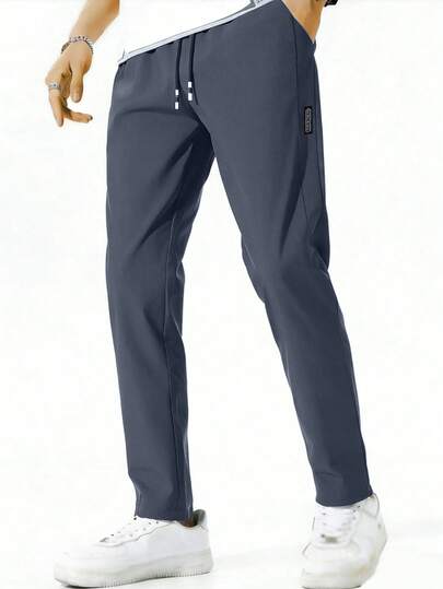 1 chiếc quần dài nam ống đứng kiểu dáng thường ngày, có dây rút điều chỉnh màu sắc ở eo, hai túi bên hông, thích hợp cho các hoạt động ngoài trời, chất liệu vải thoáng khí thoải mái, đa năng cho mọi mùa.