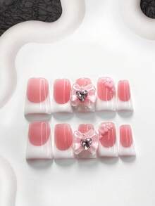 10件套简约优雅亚克力美甲套装，包含亚克力美甲贴纸、粉色3D蝴蝶结、粉色爱心水钻、花朵贴纸、白色指甲油，风格简约柔和，附赠美甲工具（1个果冻贴纸+1个指甲锉）。提供三种形状：杏仁形、鸭嘴形、棺材形，适合日常、派对、办公等场合。 - 彩色 - 查看 16