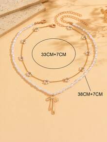 2件套奢华不对称仿珍珠串珠合金蝴蝶结花朵项链套装，百搭精致首饰，适合女孩，仿珍珠和花朵数量随机 - 彩色 - 查看 8