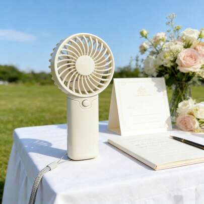 1 pièce Mini ventilateur électrique portatif avec sangle de poignet, 1 vitesse de vent, nécessite des piles AAA (non incluses)