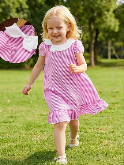A Fashionable And Elegant Girls' Casual Dress, Featuring A Vertical Striped Design, With Water Drop-Shaped Buttons And A White Bow Tie Decoration. The Fabric Is Soft And Comfortable, Suitable For Spring, Summer And Autumn Wear, And Can Be Worn For Outings, Vacations And Parties.