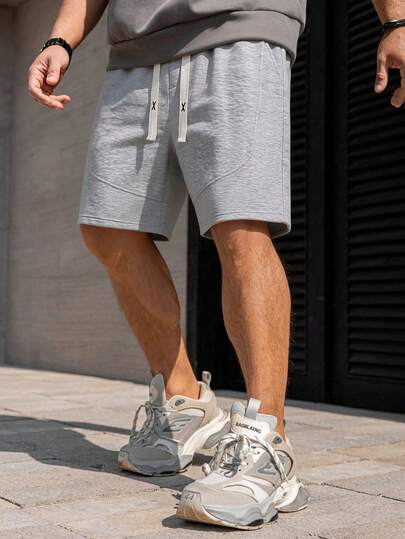 Pantalones cortos casuales de corte holgado con bolsillo 3D curvo, estilo minimalista para hombres