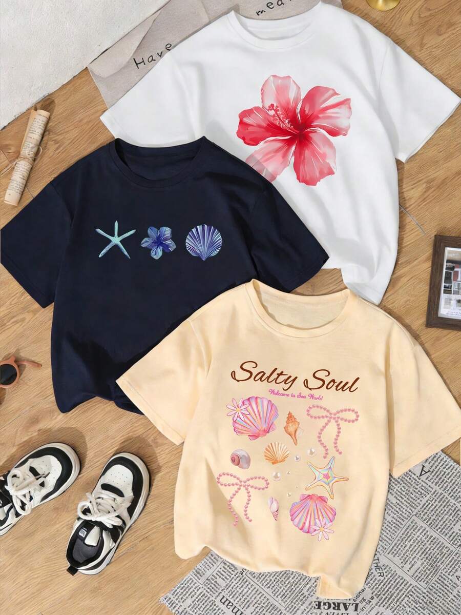 Set de 3 camisetas de manga corta con cuello redondo, estampado de flores, estrellas de mar y conchas, de estilo casual y veraniego, versátiles y adecuadas para usar en la playa o de vacaciones - Azul marino, blanco y albaricoque - Ver 1
