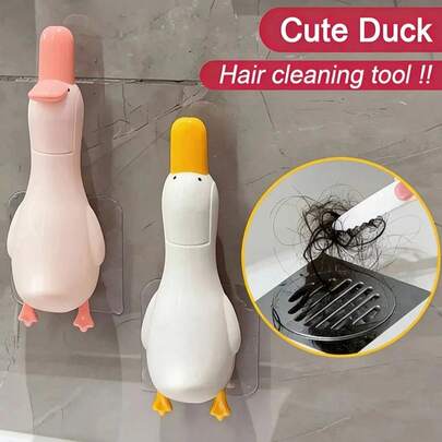 1/2个装二合一可爱鸭子造型清洁夹，有效去除灰尘和污渍。带有排水孔，适合在浴室使用，清洁毛发和其他杂物。