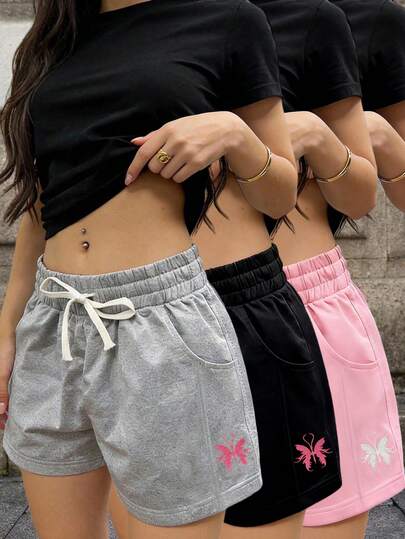 女士休闲抽绳腰短裤，高腰显瘦设计，侧边饰有粉色蝴蝶刺绣，适合日常穿着、健身、跑步、户外活动