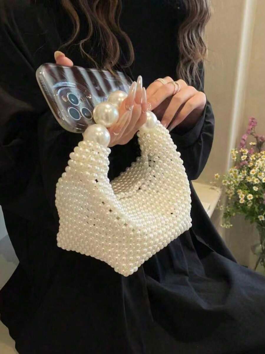 Dedoo Túi xách dệt hoàn toàn bằng ngọc trai, tay cầm ngọc trai cỡ lớn kết hợp với kỹ thuật dệt hạt tinh xảo, màu trắng tinh khiết thanh lịch thể hiện phong cách quý phái sang trọng, thu hút mọi ánh nhìn trong các bữa tối và đám cưới. - trắng - Xem 1