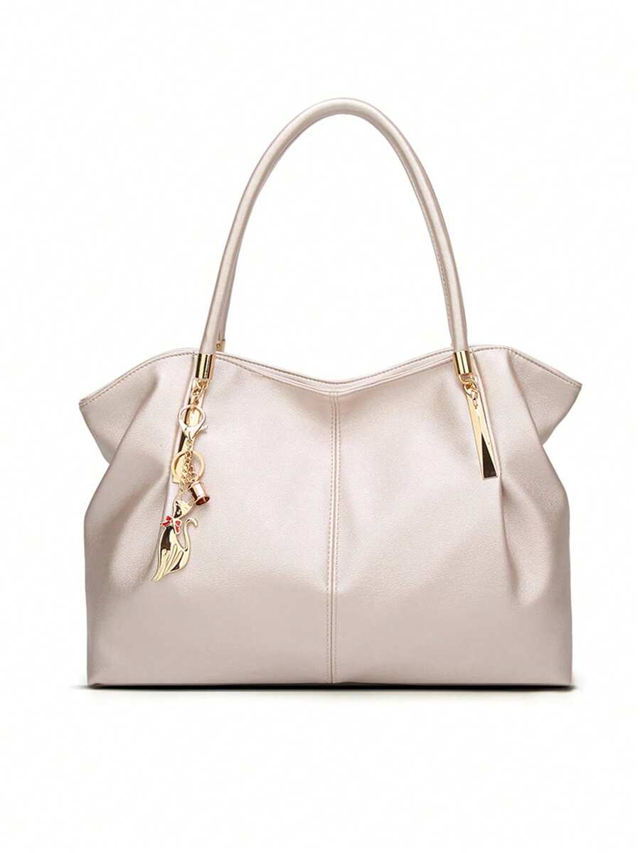 优雅单肩手提包。新款时尚百搭优雅女士托特包，大容量金属装饰PU皮革手提包，适合外出、通勤、工作、办公、度假等场合。