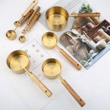 This 8-Piece Set Of Gold Stainless Steel Measuring Spoons And A Baking Measuring Cup With A Solid Wood Handle Is A Precise Measuring Tool For The Kitchen. It Is Suitable For Accurately Weighing Ingredients Such As Coffee Powder, Tea Leaves, And Sugar, Ensuring Consistent Beverage Flavor. It Is Perfect For Baristas And Tea Lovers. - màu nâu - Xem 4