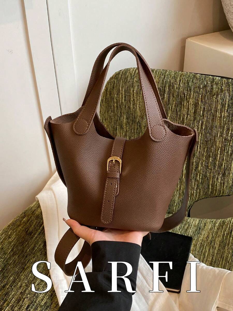 This Fashionable New Handbag Features A Minimalist Multi-Purpose Design, With Metal Buckle Accents. The Adjustable Shoulder Strap Adds A Modern, Stylish Touch, Making It Very Suitable For Shopping And Travel. It Is Lightweight And Spacious, With Ample Storage Space. - Brown - View 1
