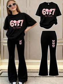 女童两件套：67数码印花粉色蝴蝶结T恤+粉色蝴蝶结喇叭裤。甜美时尚的情人节装扮，透气舒适，适合女孩日常外出，是春夏两季的理想之选。 - 黑色 - 查看 1