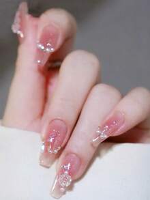 24 móng giả cỡ trung bình-dài, màu hồng phấn lấp lấp lánh, đính đá Aurora và ngọc trai, kèm gel dẻo và dụng cụ mài móng. - Nhiều màu - Xem 6
