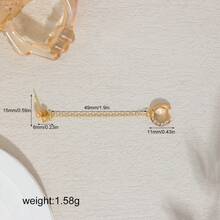 一只耳环由一条流苏链连接一个镶嵌闪亮玻璃水钻的耳钉组成，适合嘻哈、日常佩戴、音乐节和朋克风格。 - 金色 - 查看 7