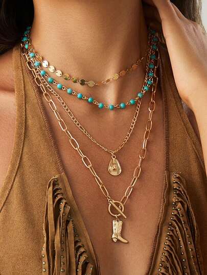 4件套复古西部牛仔风格项链套装，金色手工链条搭配金属帽子和靴子吊坠，时尚饰品，适合拍照和户外旅行佩戴。手工链条的长度和珠子数量随机裁剪。