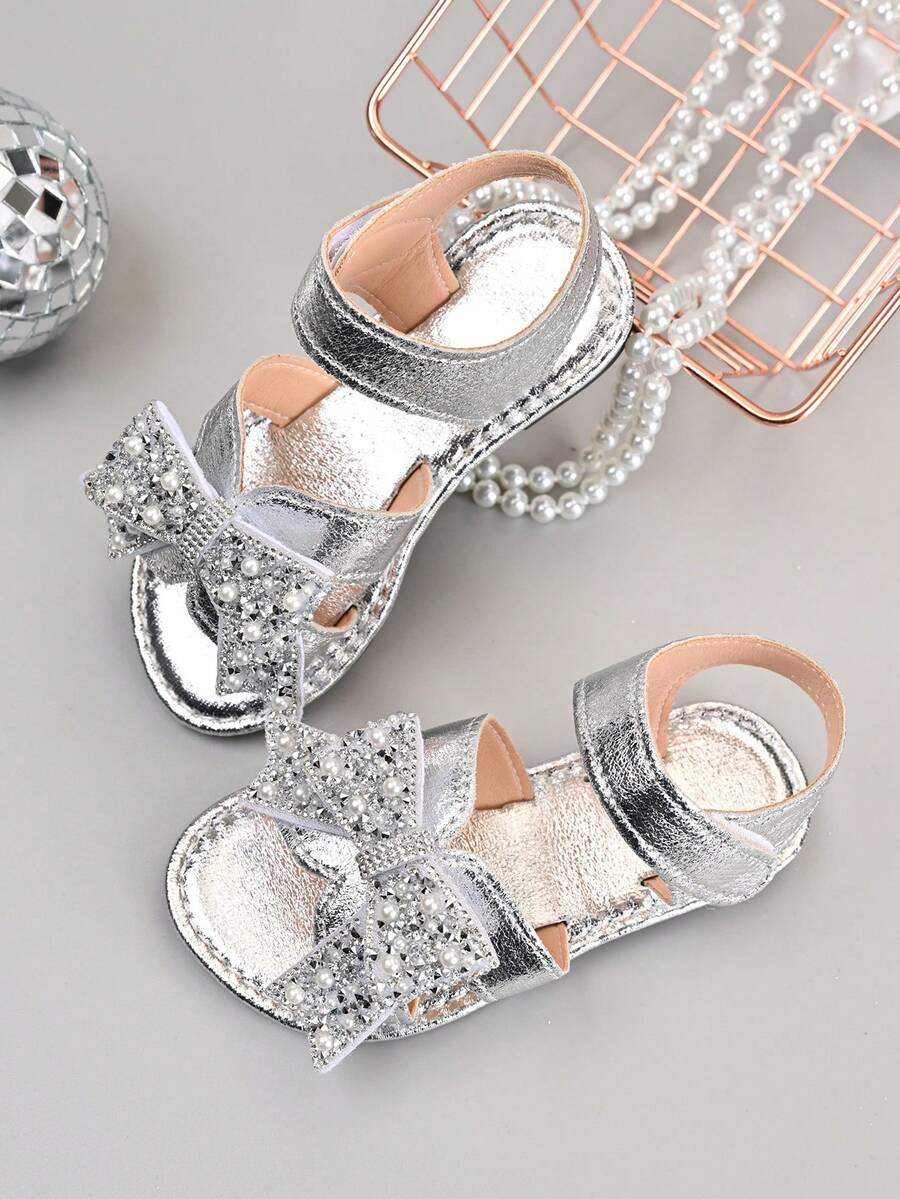 Giày sandal nơ đính đá bạc mới cho bé gái mùa hè 2026, kiểu công chúa đang thịnh hành, đế mềm chống trơn trượt. - Bạc - Xem 1