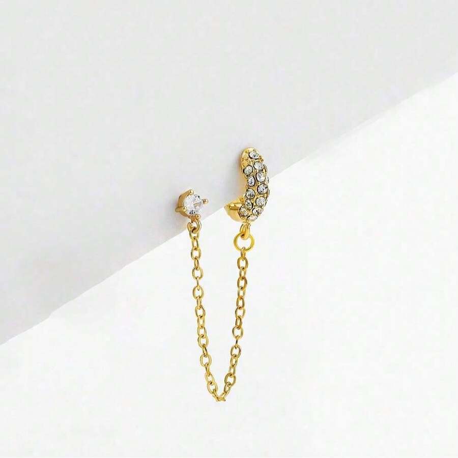 一只耳环由一条流苏链连接一个镶嵌闪亮玻璃水钻的耳钉组成，适合嘻哈、日常佩戴、音乐节和朋克风格。 - 金色 - 查看 1