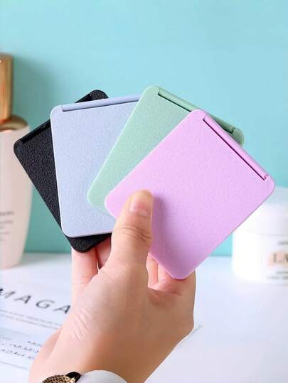 1 Stück (Lila/Grün/Blau/Schwarz) doppelseitiger quadratischer Reisespiegel - Vergrößerungstaschenspiegel für die Handtasche, faltbarer Standspiegel für den Schreibtisch/das Studentenwohnheim, süßes Geschenk für Mädchen, Reise-Make-up-Set, günstig, Valentinstag, günstige Artikel, Reise, Reiseessentials, Raumdekoration, Valentinsgeschenk, günstige Sachen, Raum, Artikel, Urlaubsutensilien, Geschenke für Frauen, Schlafzimmer, Valentinstag.