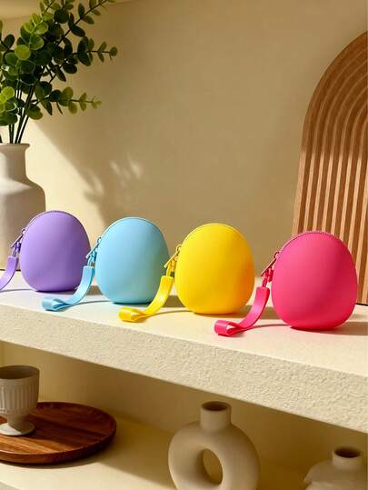 1个硅胶椭圆形化妆包，防水迷你收纳袋，可装口红、钥匙、首饰、硬币、卡片、耳机等，方便携带，内含内袋，适合户外使用。