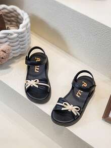 Dép xăng đan nơ mùa hè mới cho trẻ em, dép đế mềm, chống mài mòn, hở ngón dành cho bé gái đi biển. - màu đen - Xem 4