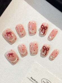 Conjunto de 10 unhas postiças quadradas feitas à mão com laço tridimensional, olho de gato vermelho com bolinhas e francesinha. Ideal para mulheres e meninas usarem no dia a dia, em festas e encontros. Acompanha cola em gel e tiras de polimento como brinde para quem gosta de unhas postiças. - Multicolorido - Ver 2