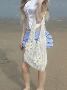 这款夏季休闲度假女士钩编沙滩手提包采用镂空设计，饰以两种精美的花卉图案，容量大，是一款实用百搭的单肩包。它非常适合海滩旅行和浪漫度假，其防沙功能也使其同样适用于这些场合。 - A - 查看 7