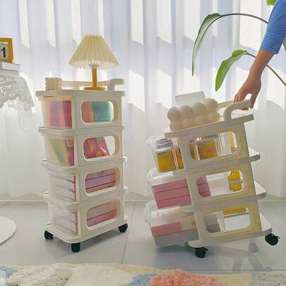 米白色塑料抽屉式储物柜，带滚轮，适合存放零食、玩具、化妆品及各种物品，是家居收纳的理想之选。