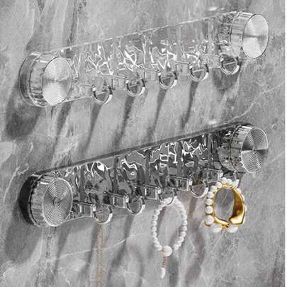 强力吸盘波浪形挂钩，无需钻孔，承重力强，可壁挂安装，适用于浴室和厨房。可无缝安装在门上或门后，用于悬挂毛巾、浴袍、衣物和配饰。防水防锈，易于清洁，可拆卸且不留痕迹。是卫生间、淋浴房、橱柜和玄关的理想之选。吸力强劲，用途广泛，设计时尚现代。