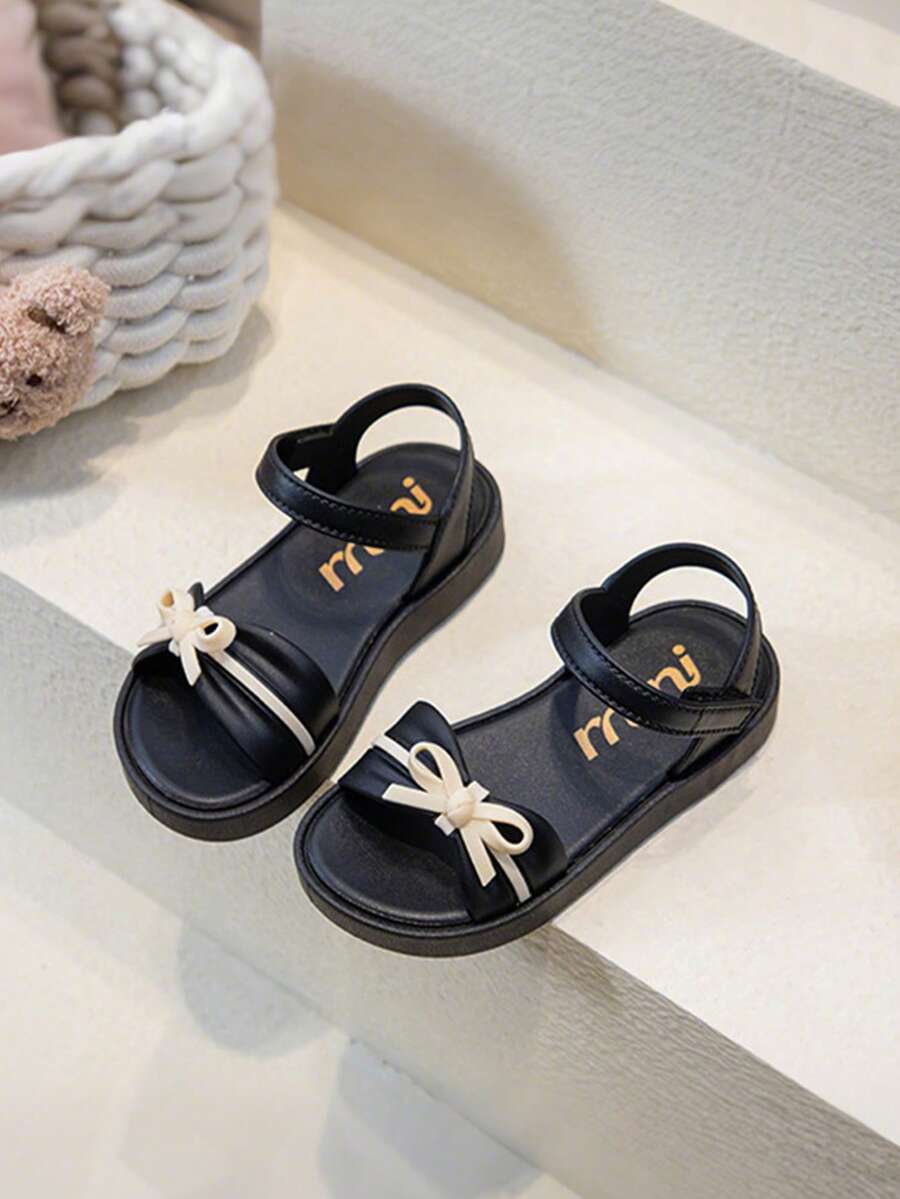 Dép xăng đan nơ mùa hè mới cho trẻ em, dép đế mềm, chống mài mòn, hở ngón dành cho bé gái đi biển. - màu đen - Xem 1