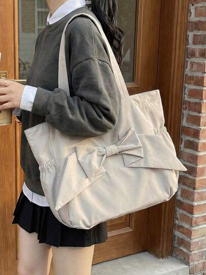 女士纯色大容量蝴蝶结手提包，简约学院风单肩包，搭配 3D 蝴蝶结设计，通勤上学百搭实用，清新文艺风。