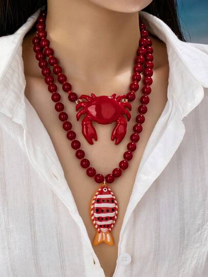 1 pieza Collar de cuentas rojas con colgante de cangrejo y pez - Collar declarativo náutico audaz con encantos de vida marina - Joyería de vacaciones playeras para mujeres