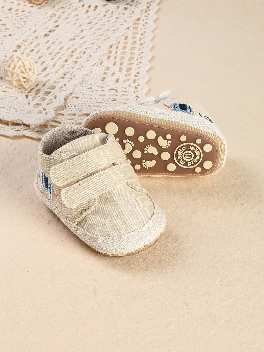 1双可爱卡通扁平设计婴幼儿男女童休闲运动鞋，适合春秋季穿着