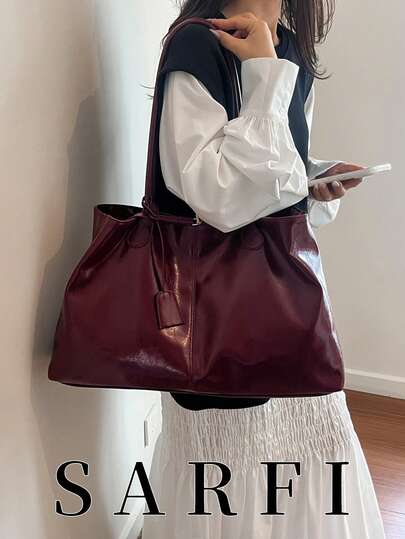 This Is A Large-Capacity, Pleated Decorative Pendant In Pure Burgundy For Women. It Is Made Of High-Quality, Wear-Resistant, Waterproof, And Scratch-Resistant Glossy Pure PU Material. The Modern Magnetic Closure Design Makes It Easy To Take Out And Put Away. It Is Suitable As A Gift For Friends, For Shopping, Dating, Commuting To Work, Taking Photos, Business Trips, And Travel.