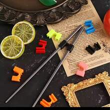 12 piezas Palillos de entrenamiento para niños, fáciles de usar, ayuda práctica para sujetar, clips de entrenamiento, utensilios de cocina y bar para el hogar - Ver 6