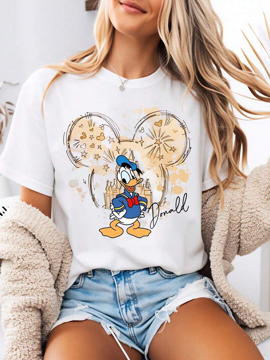 Disney-Style Women's Graphic Tee Featuring A Standing Donald Duck Print With A Watercolor Mickey Mouse Silhouette. This Women's Summer Clothing Item Is A Crew Neck Tee Made From Soft, Comfortable 100% Cotton Fabric. Perfect For Everyday Wear, Outdoor Activities, Or Shopping Outings. Also Ideal As Women's Vacation Wear. - White - View 1