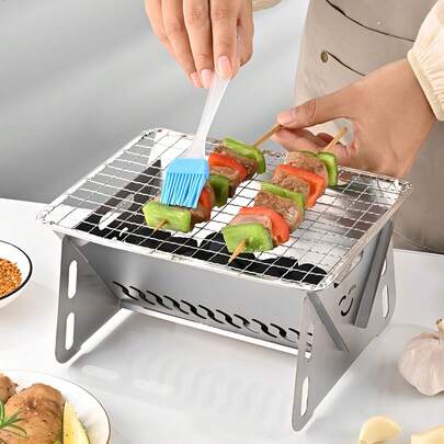 便携式不锈钢炭烤炉 | 可折叠轻便烧烤炉，适合户外露营、野餐、背包旅行和户外聚餐 | 紧凑型桌面烧烤炉，带通风设计 | 耐用防锈 | 易于清洁和组装