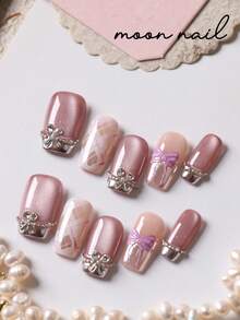 10片紫色猫眼蝴蝶结闪光钻石条纹美甲贴片，适用于短指甲，包含1张粘合贴片和1个迷你指甲锉。 - 彩色 - 查看 2