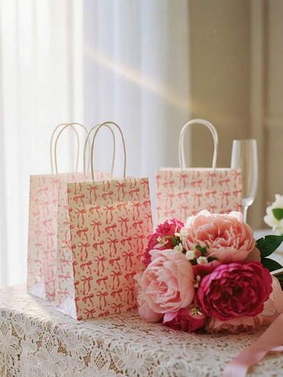 1个（8.26*5.9*3.15英寸）粉色蝴蝶结纸质礼品袋，适用于2026年毕业派对用品、单身派对用品、毕业派对用品、婚礼回礼、新娘伴娘礼物