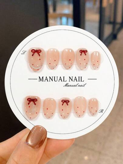 JUTI 情人节特惠！10片装短椭圆美甲，浪漫甜美手绘红色丝带蝴蝶结+波点裸粉色闪粉透明底，100%纯手工制作手绘按压式美甲（情人节美甲），适合日常、休闲及节日场合。