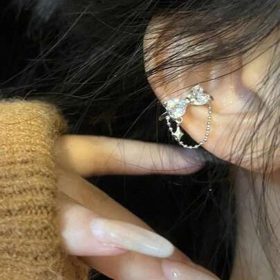 1 pieza Clip de oreja con lazo asimétrico y flecos para mujer, adecuado para uso diario