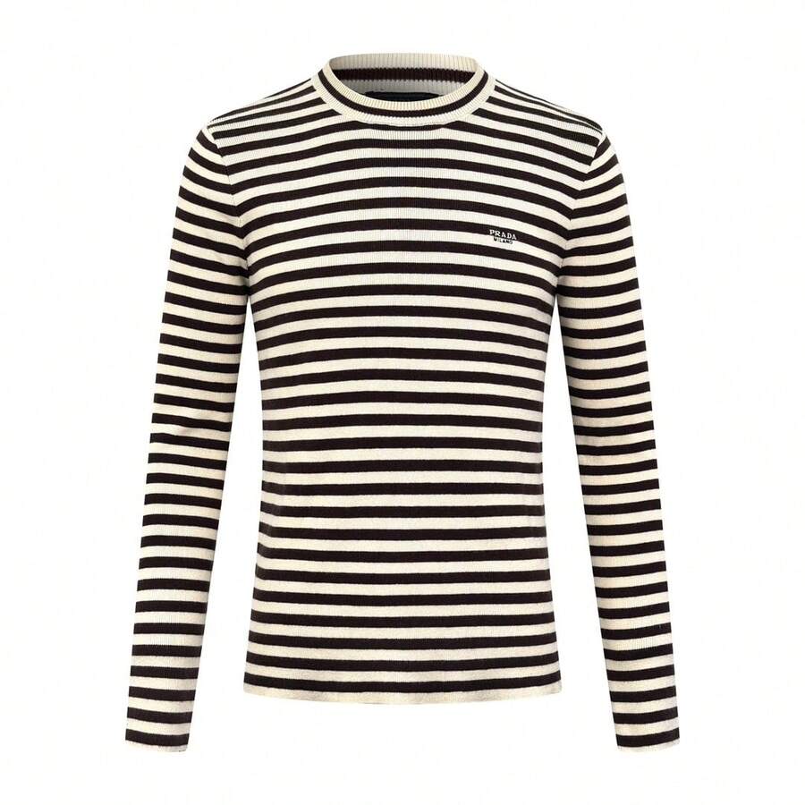 Prada Striped Embroidered Crew Neck Sweater, Custom-Knitted Mercerized Wool Blend Fabric, Soft, Delicate, Comfortable Against The Skin. The Creamy Hue And Warm Brown Tones Intertwine In The Knit Texture, Creating A Design Tension Between Movement And Stillness. The Iconic Prada Embroidery, A Subtle Yet Powerful Logo Hidden Among The Stripes, Flows In The Sunlight, The Logo Appearing And Disappearing In The Light And Shadow. The Design Is Seamlessly Integrated, Achieving The Ultimate In Aesthetics. Using Stripes As The Brush And Knitting As The Ink, A New Chapter Of Fashion Is Woven. Imported Machine Embroidery Technology, Using An Advanced Computer Control System And Precision Mechanical Parts, Achieves High Precision In Prada Embroidery, Resulting In Smooth And Delicate Lines. - 25341-B30 - Xem 1