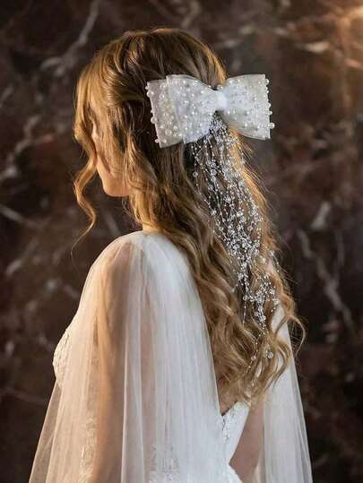 1件优雅蝴蝶结流苏新娘头饰，婚礼派对发饰。蝴蝶结款式搭配超长珍珠流苏，适合日常佩戴和各种正式场合。