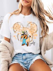 Disney-Style Women's Graphic Tee Featuring An Orange Mickey Mouse Head With Goofy Walking Cartoon Print. Women's Summer Clothing With A Crew Neck Design. Made From Soft And Comfortable 100% Cotton Fabric, Perfect For Everyday Wear, Outdoor Activities, Or Shopping Outings. Also Ideal As Women's Vacation Wear. - White - View 1
