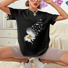Camiseta de mujer de manga corta negra - Estilo bohemio y delicado - Estampado de margarita con mariposa que se transforma en libélulas, diseño etéreo y elegante - Ropa diaria cómoda para mujer, confeccionada en suave mezcla de algodón, ideal para trabajo y looks cotidianos. - Negro - Ver 5