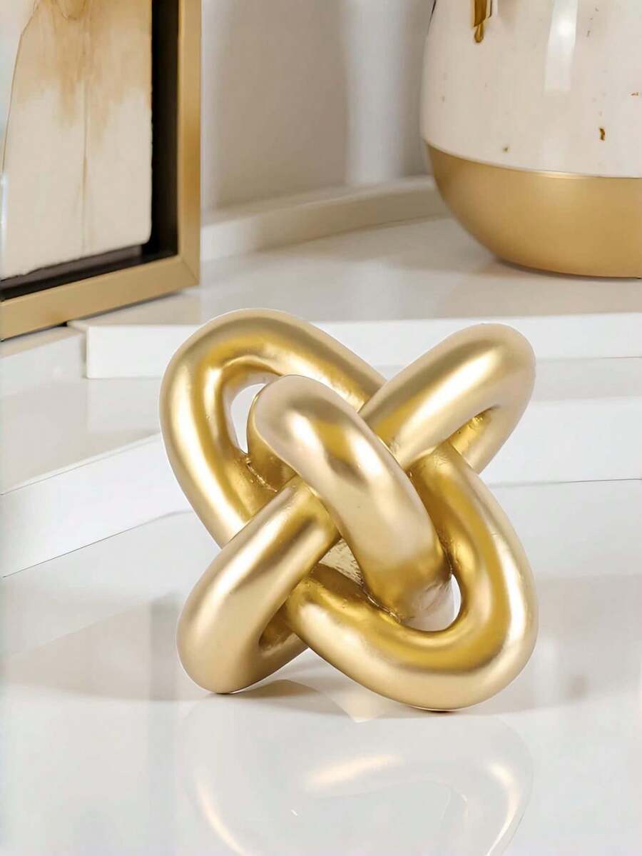 This Gold-Colored Knotted Decorative Piece Is Made Of Three Interlocking Rings, Very Suitable As A Decorative Item On A Coffee Table Or Shelf. This Handcrafted Modern Rustic Bohemian Style Wooden Knotted Chain Is Ideal For Decorating The Living Room. - Multiple Styles - View 1