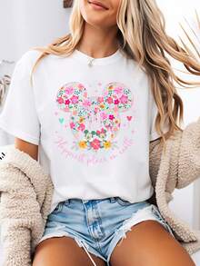 Disney-Style Women's Printed T-Shirt Featuring A Cartoon Print Of Mickey And Minnie Mouse Amidst A Floral Pattern Shaped Like Mickey's Head. This Round-Neck Summer Top Is Crafted From Soft, Comfortable 100% Cotton Fabric, Perfect For Everyday Wear, Outdoor Activities, Or Shopping. It Also Makes An Ideal Choice For Women's Vacation Wear. - White - View 1