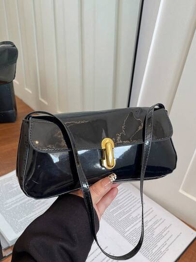 1个黑色PU皮革简约时尚休闲纯色单肩包，配金属锁扣，适合女性日常使用