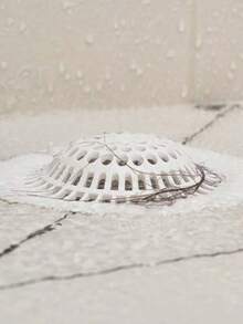 半个白色硅胶毛发收集器，适用于淋浴/浴缸排水口，带吸盘，可收集毛发并防止堵塞。是浴室水槽和厨房管道的理想家用解决方案。易于安装的排水盖 - 由耐用硅胶制成。非常适合日常收集毛发，保持排水顺畅。 - 彩色 - 查看 6