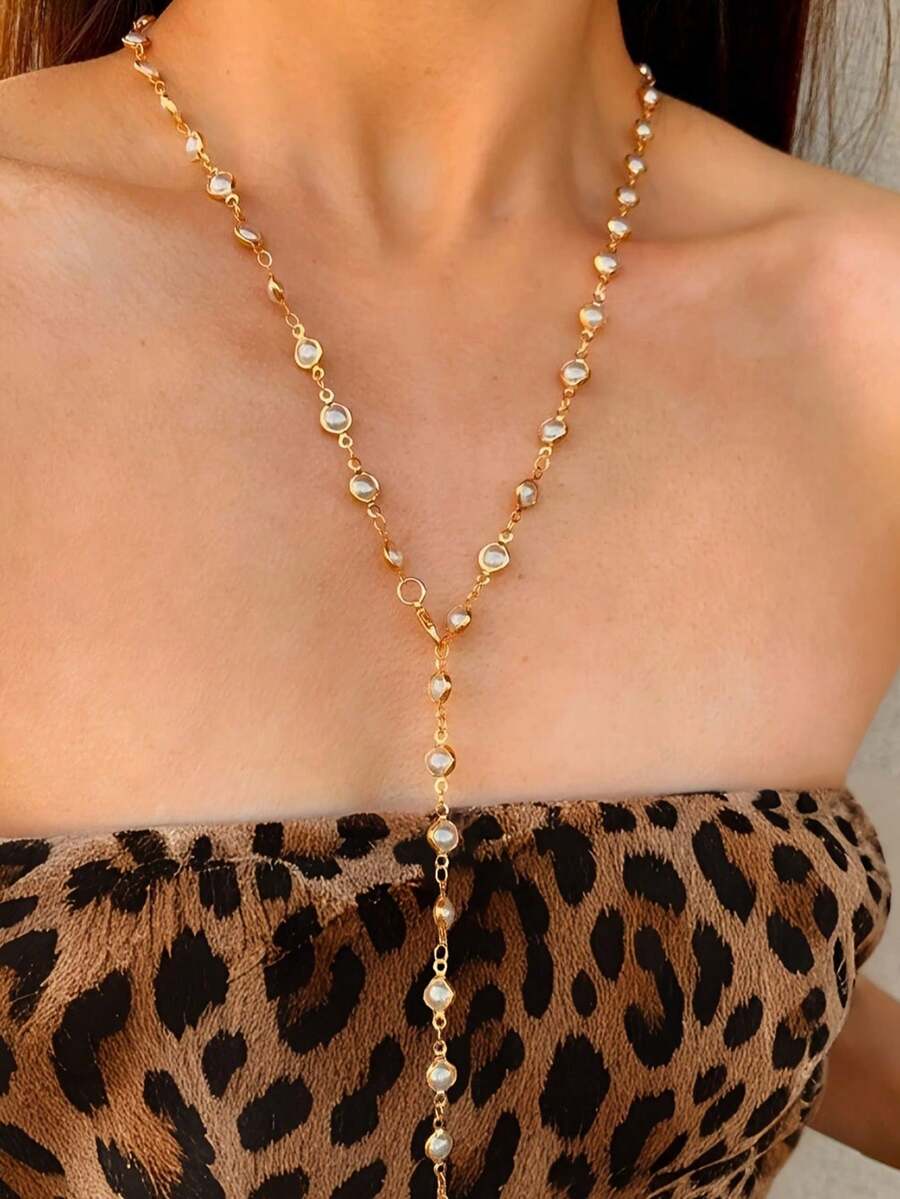 一条Y字形长项链，饰有仿珍珠边，搭配闪亮吊坠，适合日常佩戴、外出、派对、度假等场合，深V领设计，优雅波西米亚风，奢华简约时尚。 - 金色 - 查看 1