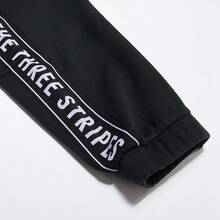 Adidas 男女通用针织慢跑裤，休闲运动训练裤，带保暖内衬，IK7340 - 黑色 - 查看 3