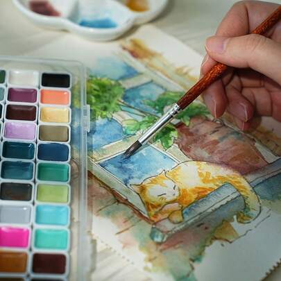 60-Farben Aquarellfarben Set | Lebendige, intensive Palette mit verschiedenen Farben, perfekt für Künstler, Hobbykünstler und Bastler, präsentiert auf einem Arbeitstisch